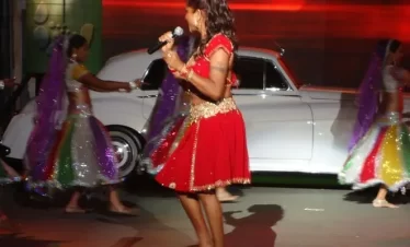 East Indian singer and dancers doing a performance.