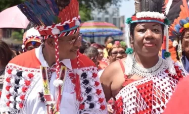chief of the first people head the procession in port of spain tinidad