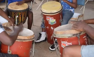 Drumers exploring the rhythm patterns of the different drums