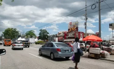people moving through the city of Independence square, port of spain trinidad