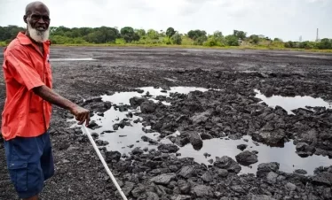 pitch lake after an area has been dug up in preparation foe processing for use