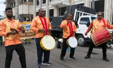 drummers of the east-indian community play the tassa drums in the streets